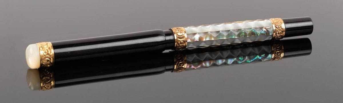 Parker pen number 45 alternating corrugated mother-of-pearl and abalone slabs. Cap topped